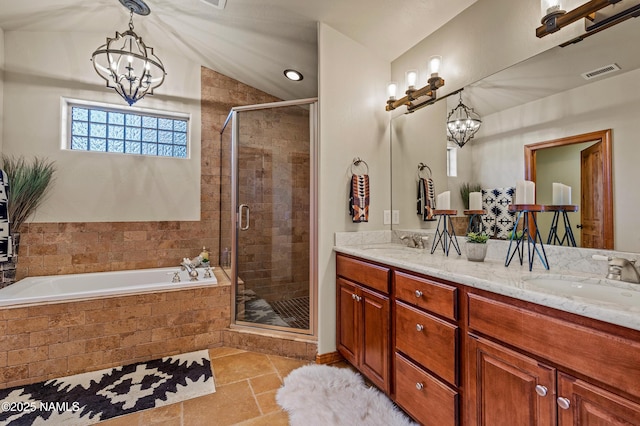 bathroom with vanity, vaulted ceiling, a chandelier, and separate shower and tub