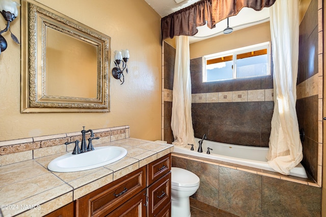 full bathroom featuring vanity, toilet, and shower / bathtub combination with curtain