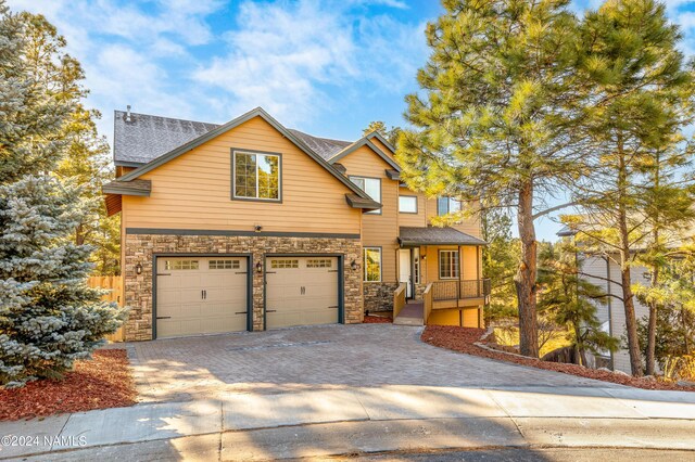 craftsman inspired home with a garage