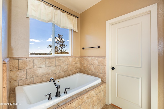 bathroom featuring tiled bath