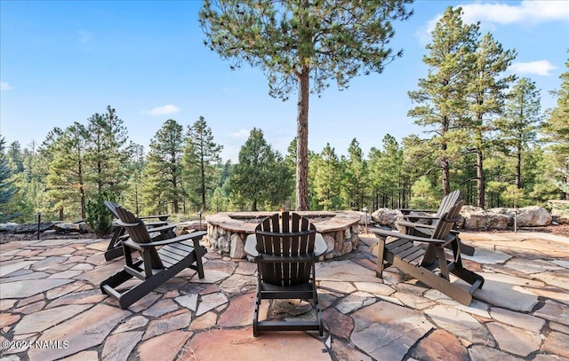 view of patio with a fire pit