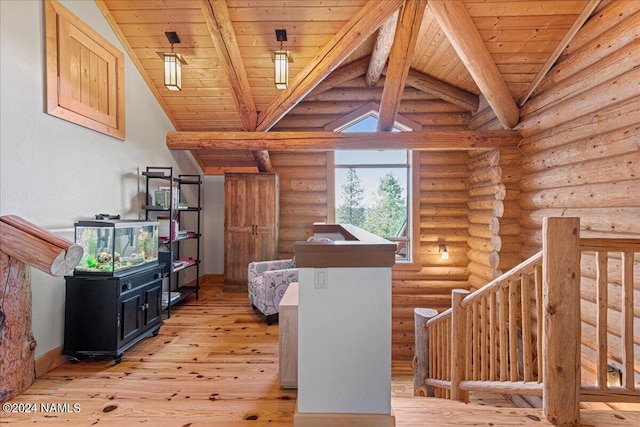 interior space with light hardwood / wood-style flooring, log walls, wood ceiling, and vaulted ceiling with beams