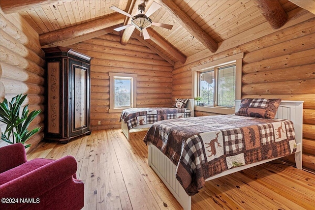 bedroom featuring lofted ceiling with beams, light hardwood / wood-style flooring, ceiling fan, and wood ceiling