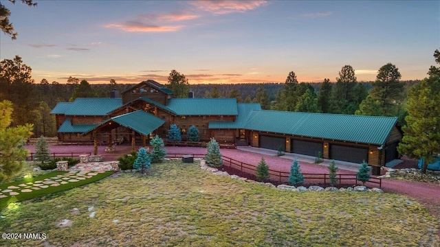 log cabin featuring a lawn