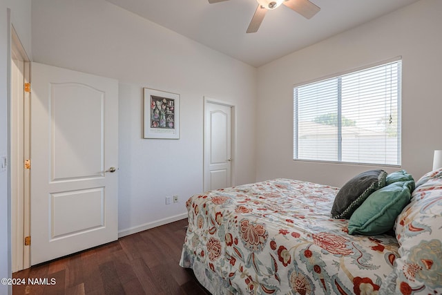 bedroom with ceiling fan and dark hardwood / wood-style flooring