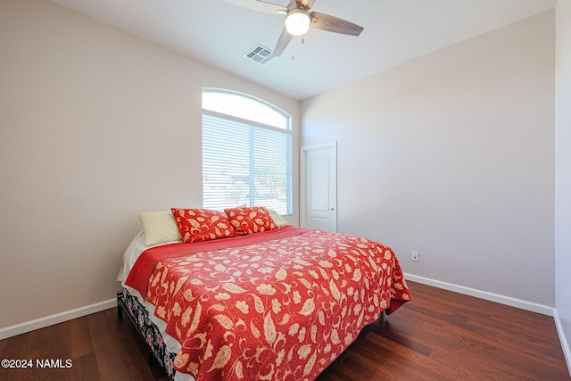 bedroom with ceiling fan and dark hardwood / wood-style flooring