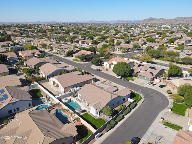 birds eye view of property with a mountain view