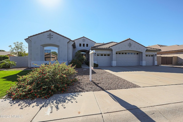 mediterranean / spanish-style house featuring a garage