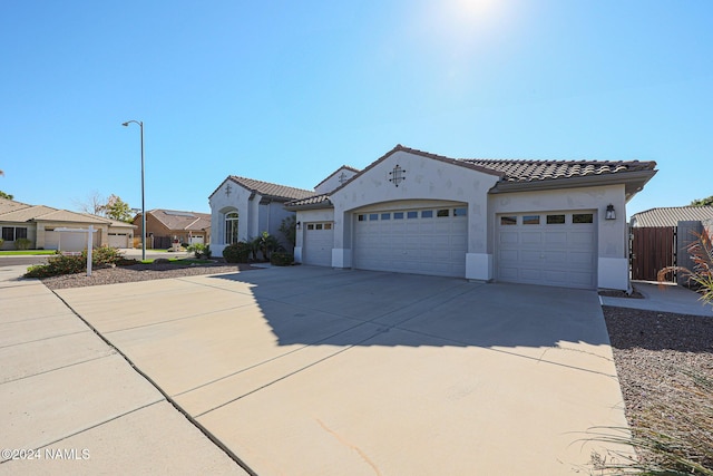 mediterranean / spanish-style home featuring a garage