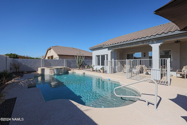 view of pool featuring an in ground hot tub, ceiling fan, and a patio