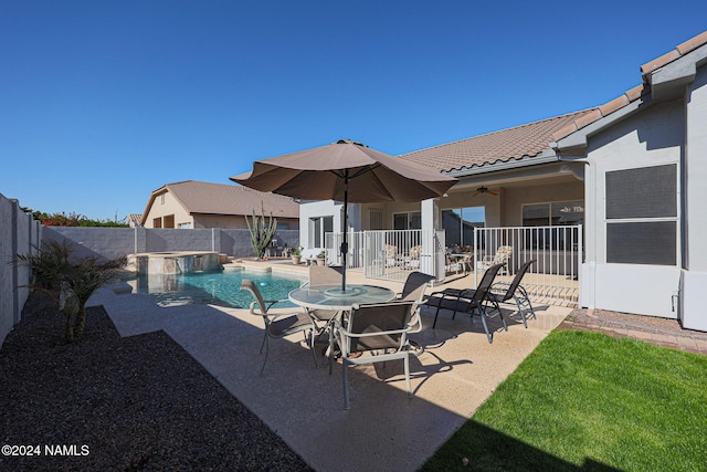 view of pool featuring ceiling fan and a patio