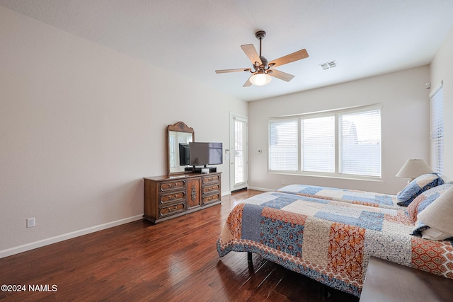 bedroom with ceiling fan and dark wood-type flooring