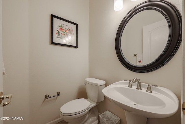 bathroom featuring sink and toilet