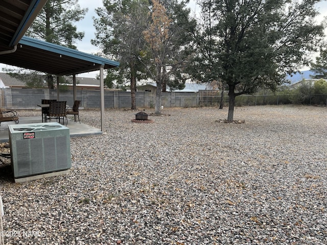 view of yard with a patio area and central air condition unit