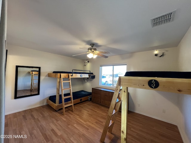 bedroom featuring wood-type flooring and ceiling fan