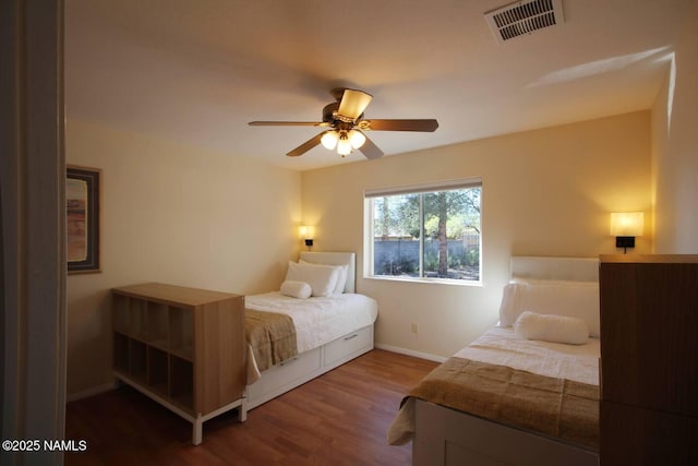 bedroom with wood-type flooring and ceiling fan