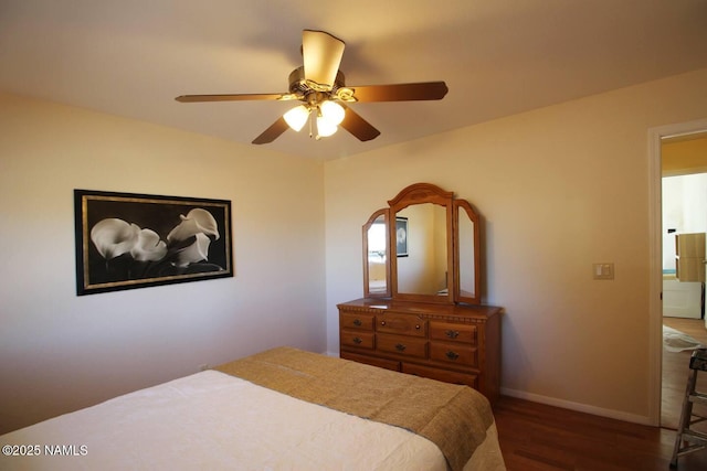 bedroom featuring dark hardwood / wood-style flooring and ceiling fan