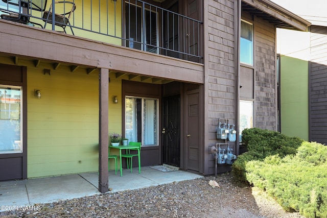 doorway to property featuring a balcony