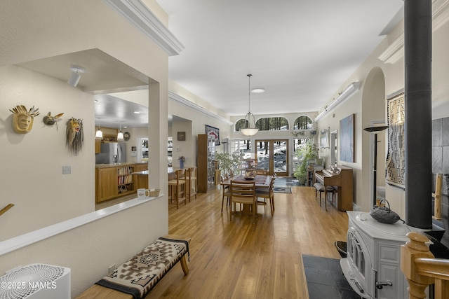 interior space featuring ornamental molding and wood finished floors