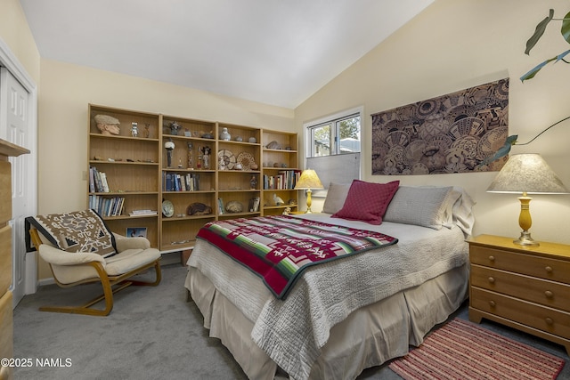 carpeted bedroom with lofted ceiling