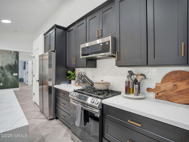 6136 E Abineau Canyon Dr, Flagstaff, AZ 86004 - kitchen featuring appliances with stainless steel finishes, light stone countertops, and recessed lighting