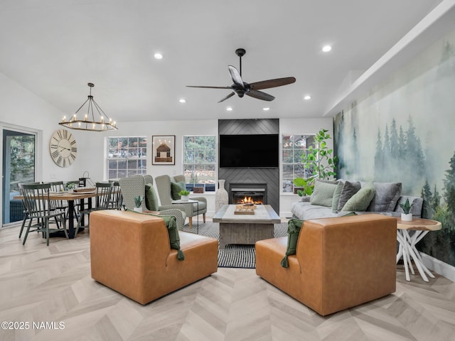 6136 E Abineau Canyon Dr, Flagstaff, AZ 86004 - living area with a large fireplace, a ceiling fan, recessed lighting, and a chandelier