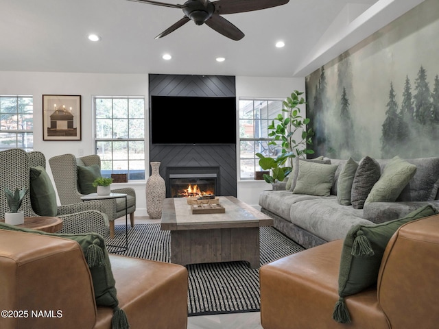 6136 E Abineau Canyon Dr, Flagstaff, AZ 86004 - living room featuring recessed lighting, ceiling fan, plenty of natural light, a large fireplace, and wood finished floors