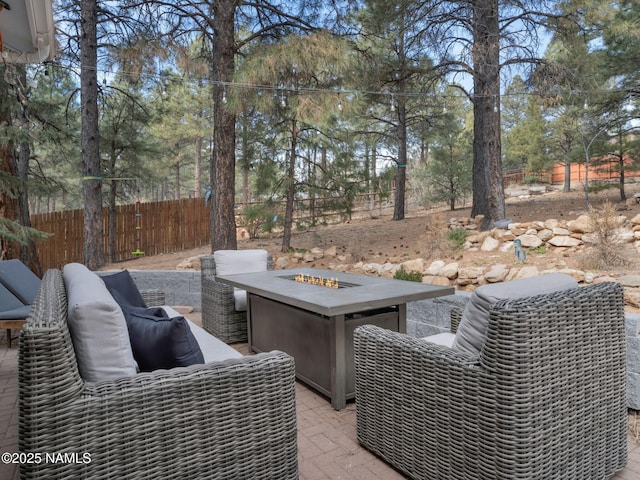 6136 E Abineau Canyon Dr, Flagstaff, AZ 86004 - view of patio with an outdoor fire pit and view of scattered trees