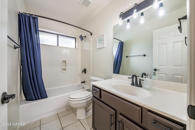 full bathroom featuring vanity, toilet, tile patterned floors, and shower / bath combo with shower curtain