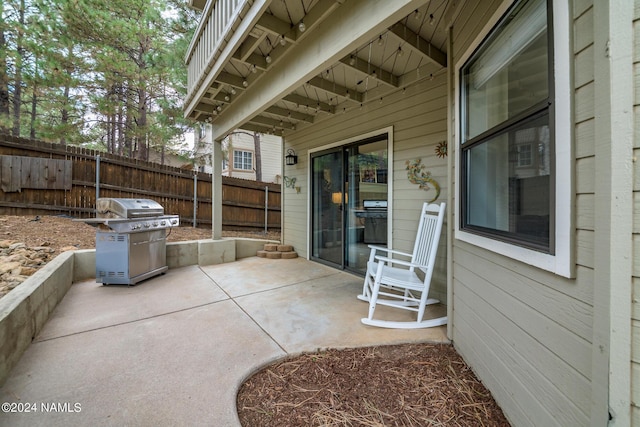 view of patio featuring a grill