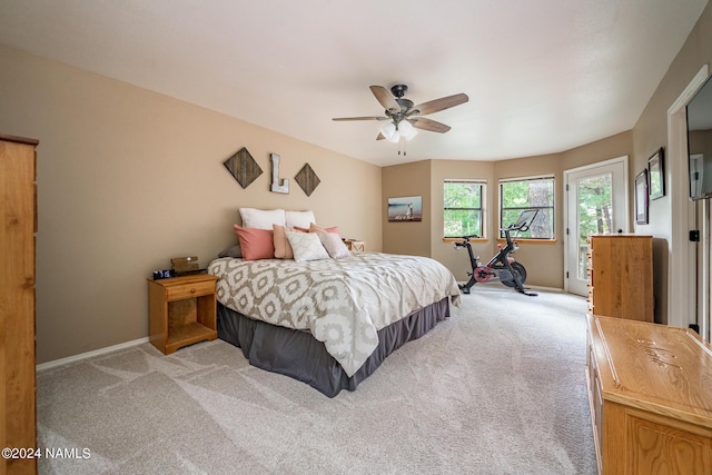 bedroom featuring ceiling fan and light colored carpet