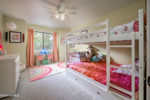 bedroom with ceiling fan and light carpet