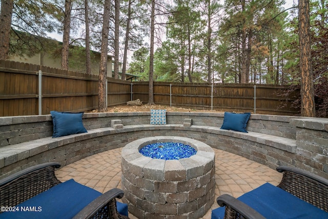 view of patio featuring an outdoor fire pit