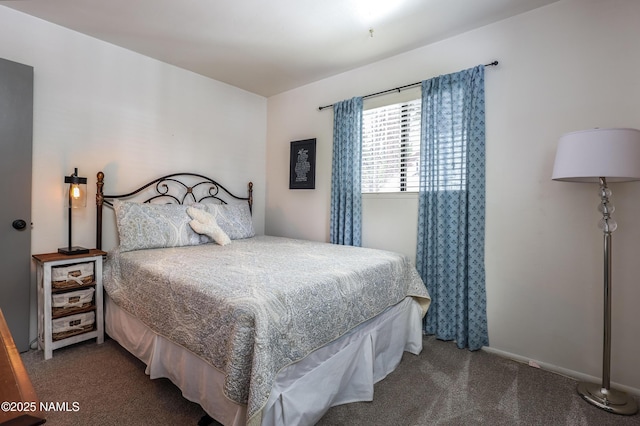 carpeted bedroom featuring baseboards