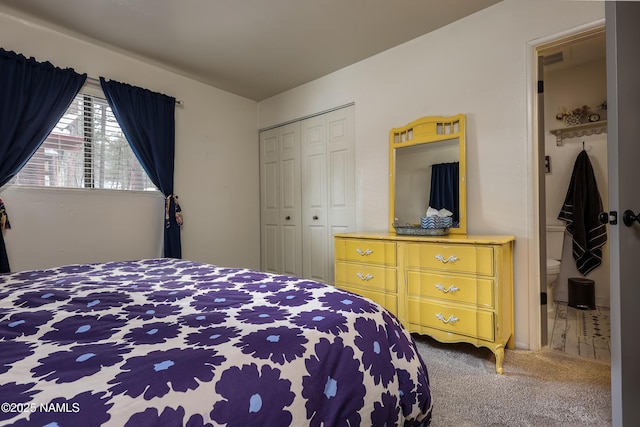 bedroom featuring a closet and carpet floors