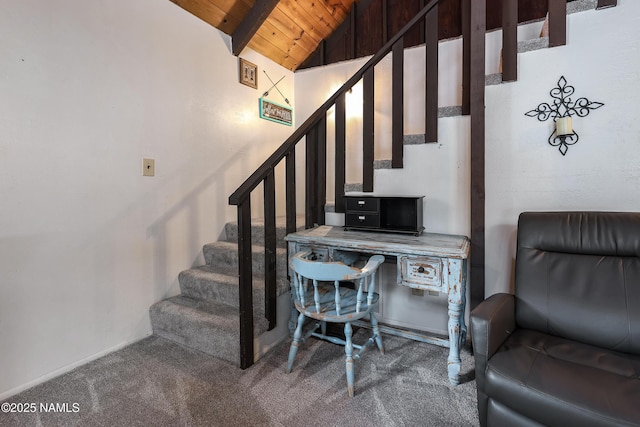 stairway with wood ceiling, vaulted ceiling with beams, and carpet