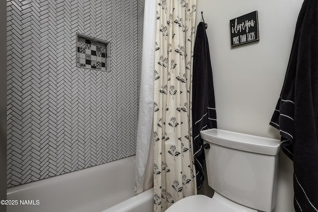 bathroom with toilet and shower / bath combo