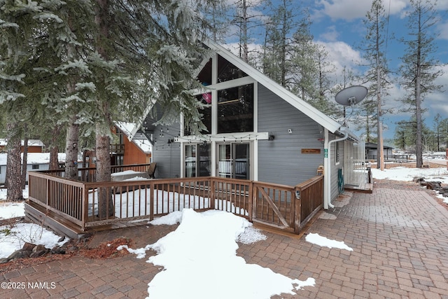 view of front of home with a wooden deck