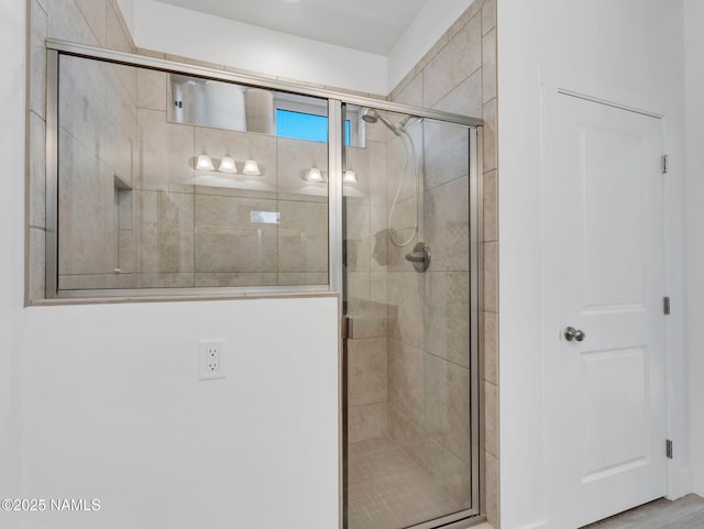 full bath featuring a shower stall