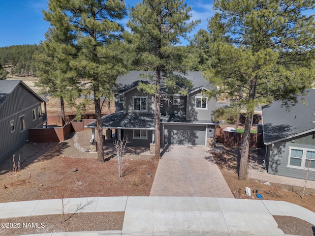 view of front of house featuring a garage and decorative driveway