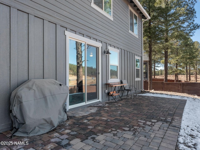 view of patio featuring grilling area and fence