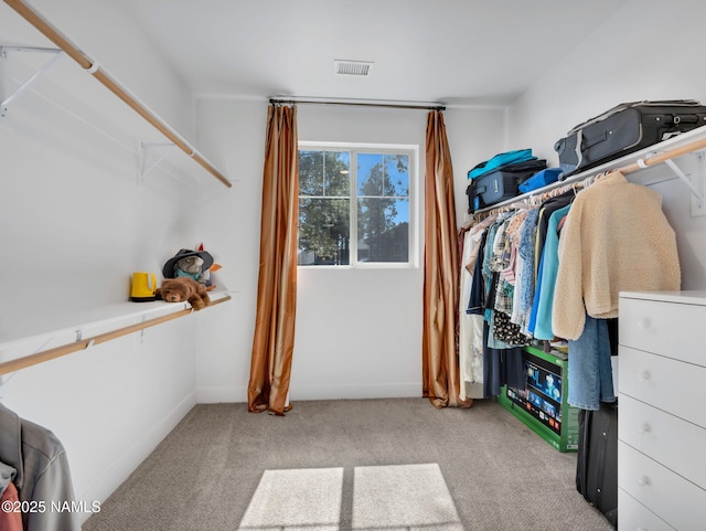 spacious closet with light carpet and visible vents