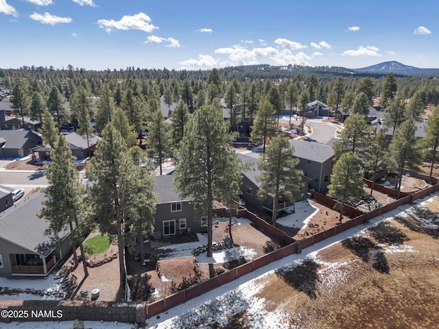 aerial view featuring a mountain view and a wooded view