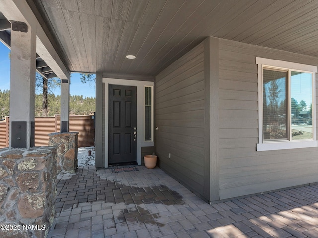 entrance to property featuring a patio