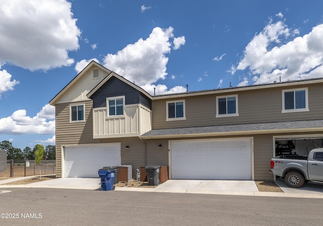 12296 Curtis Ct, Bellemont, AZ 86015 - view of front of home with a garage, board and batten siding, and concrete driveway