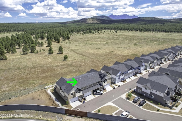 12296 Curtis Ct, Bellemont, AZ 86015 - aerial perspective of suburban area with mountains and a forest