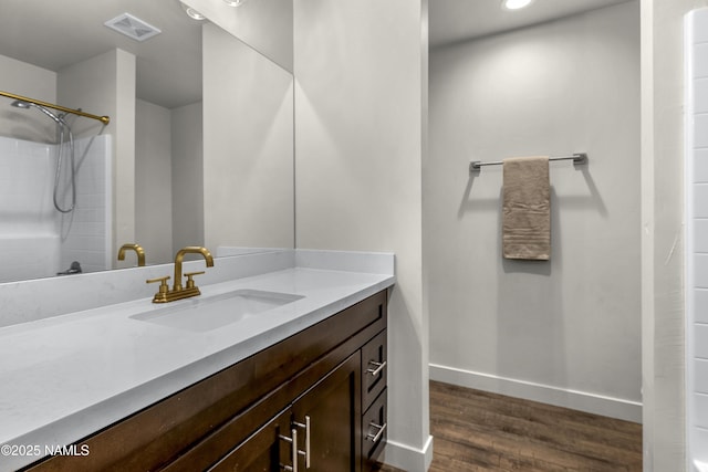 12296 Curtis Ct, Bellemont, AZ 86015 - bathroom featuring wood finished floors, vanity, a shower, and recessed lighting
