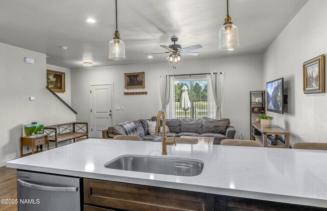 12296 Curtis Ct, Bellemont, AZ 86015 - kitchen featuring dishwasher, open floor plan, light countertops, decorative light fixtures, and recessed lighting