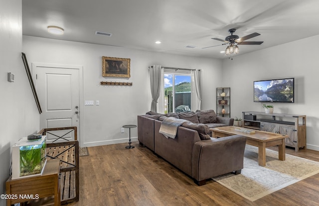 12296 Curtis Ct, Bellemont, AZ 86015 - living area with dark wood finished floors, ceiling fan, and recessed lighting