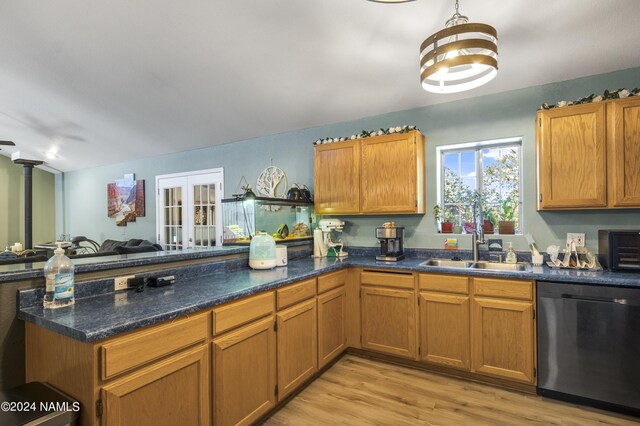 kitchen with stainless steel dishwasher, sink, light wood-type flooring, french doors, and kitchen peninsula